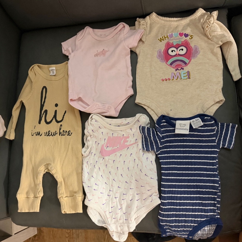Nike Infant White One-Piece Bodysuit with Pink Logo